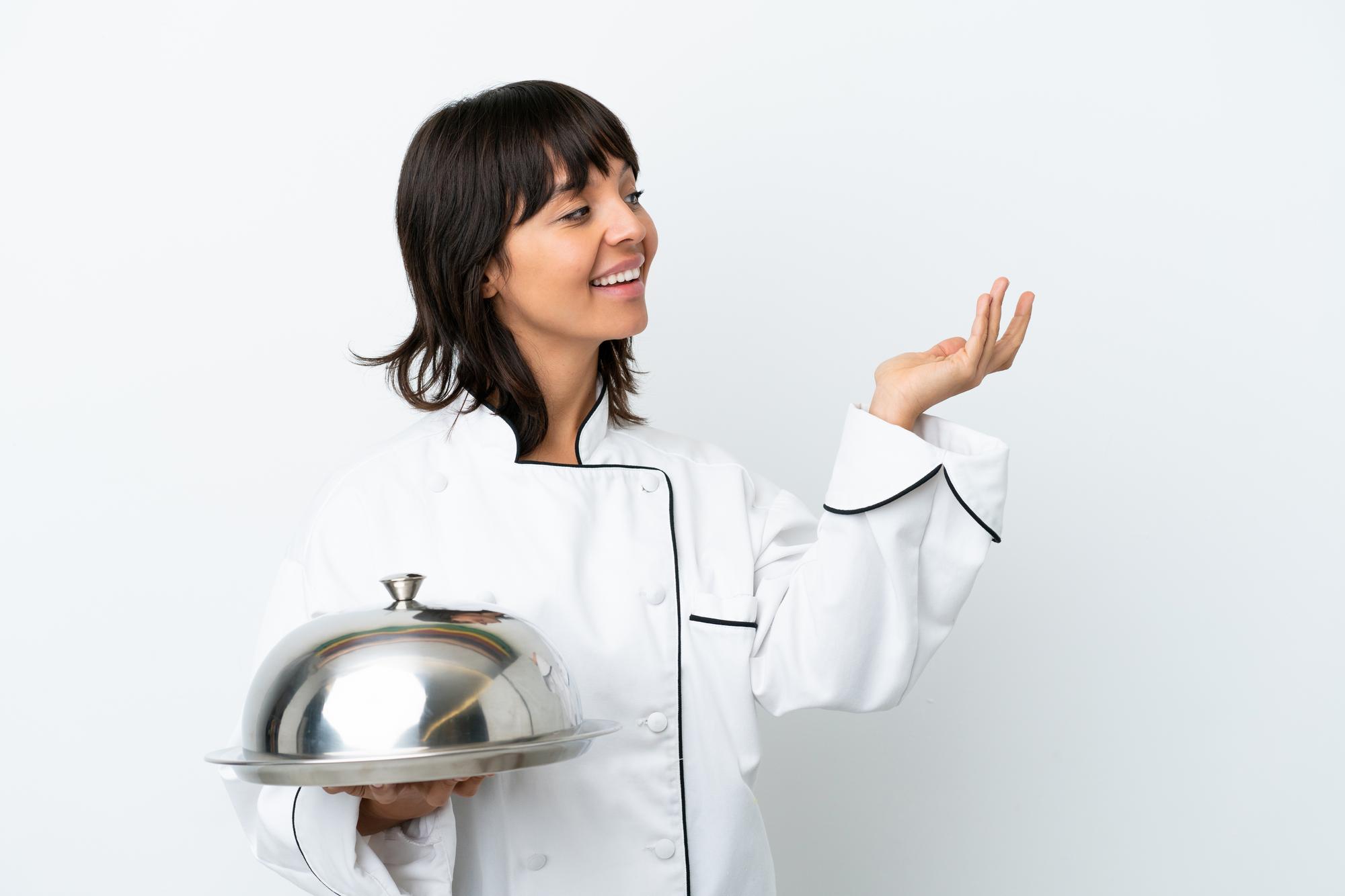 Teacher inviting people into culinary studio